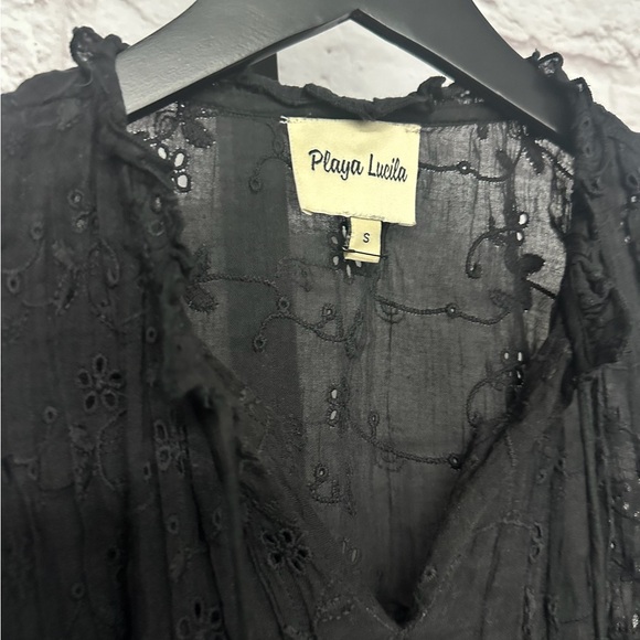 Subtle eyelet patterning, delicate ruffles, and a layered skirt - Picture 2 of 4